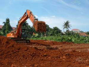 Pekerjaan pengurugan tanah menggunakan alat berat excavator